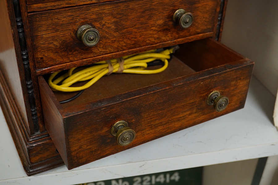 A Victorian oak miniature chest with sliding top, 31.5cm wide, 32cm high. Condition - good